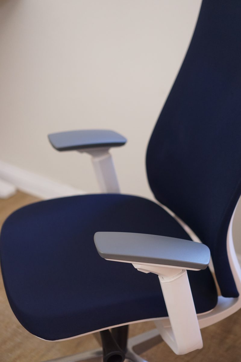 Close view of a Eurotech Elevate armrest and its navy fabric seat